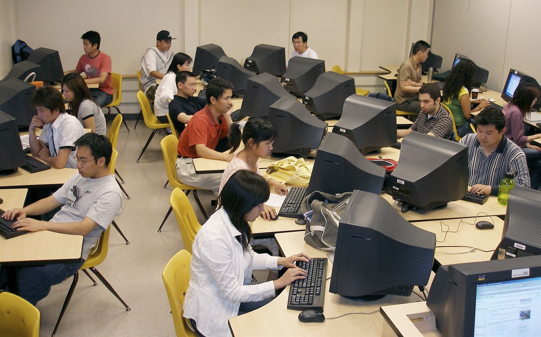 Computer lab representing software operations and workflow systems for AI-native roll-up strategies.