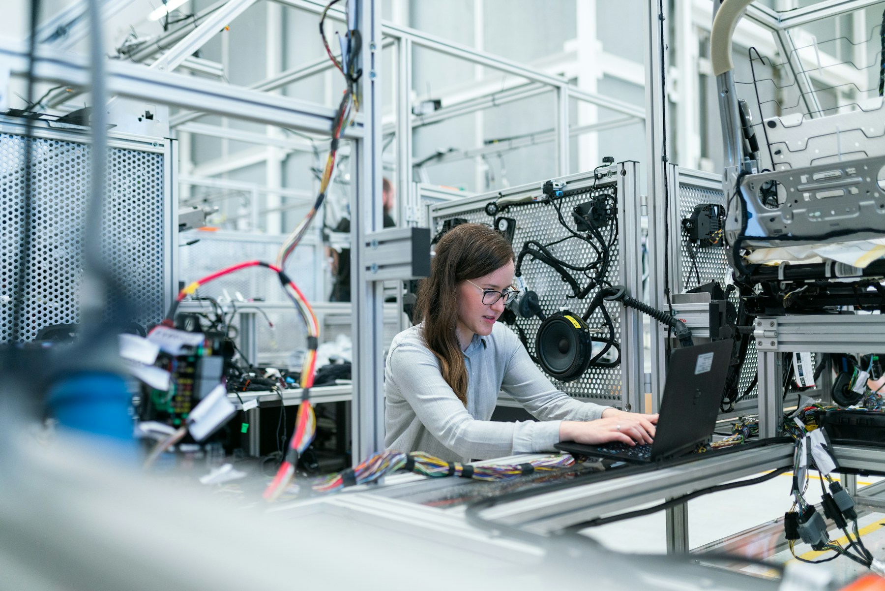 Scientist and laboratory equipment representing AI-enabled bio-automation.