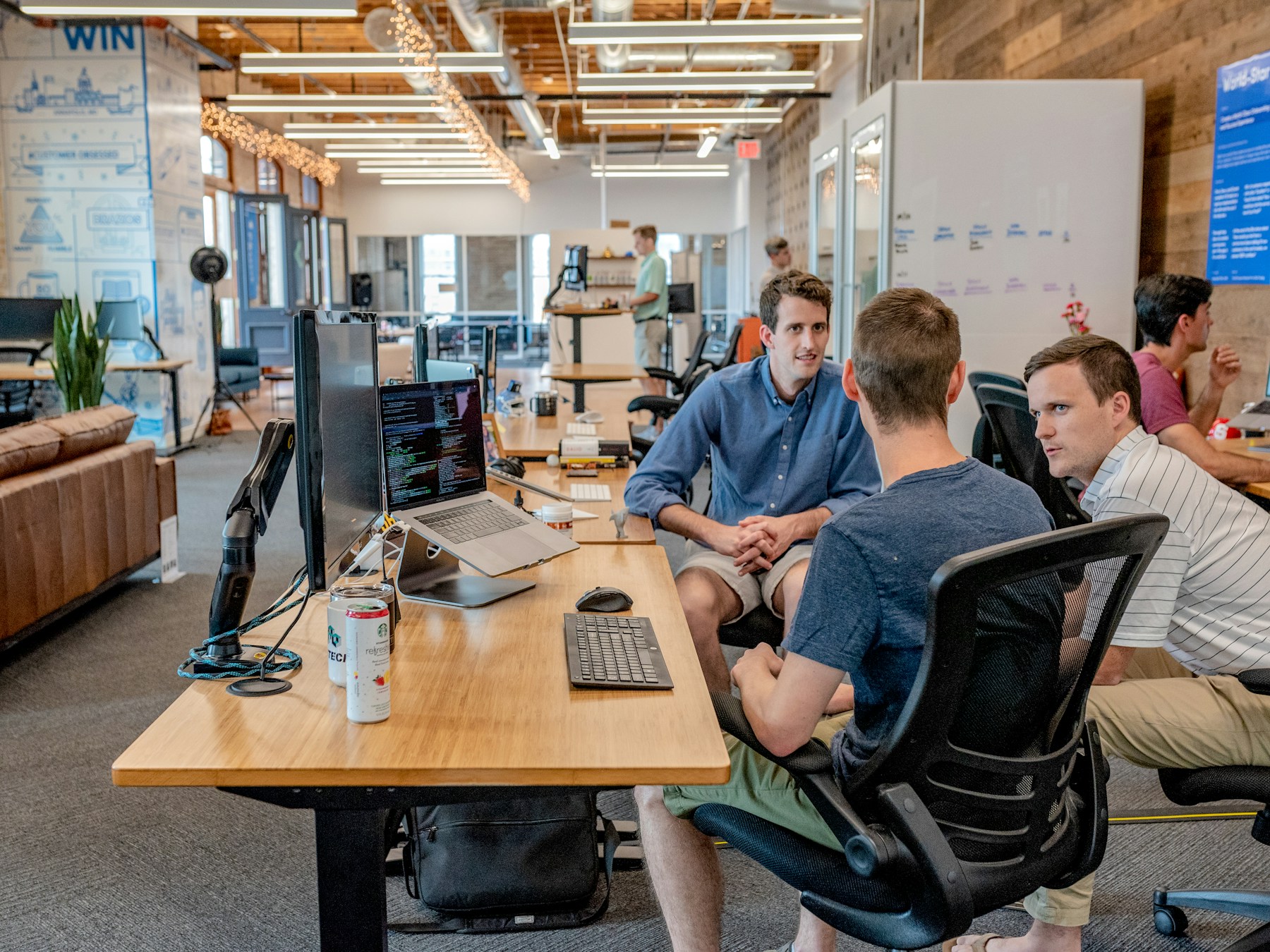 Business workshop and customer implementation setting representing AI adoption loops.