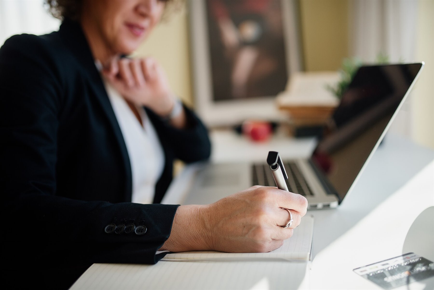 Business team working around a modern office desk, representing startup operating discipline.